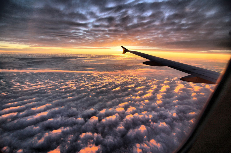 sunset-above-the-clouds-from-an-airplane.jpg
