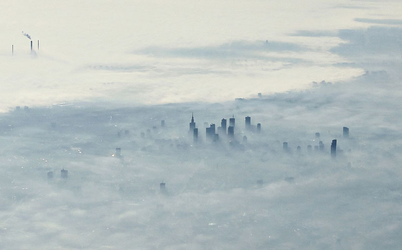 warsaw-poland-covered-in-fog-from-an-airplane-aerifal-from-above.jpg