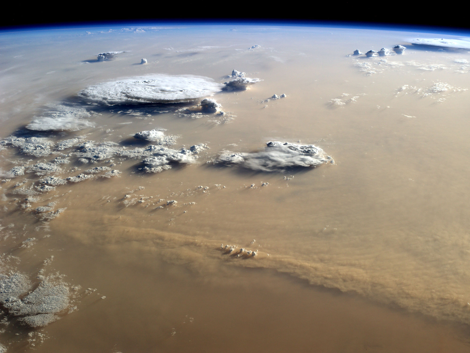 Dust and Clouds Over the Sahara Desert.jpg